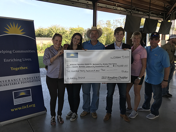 IICF Houston Chapter Board members presenting the first grants from the IICF Hurricane Harvey Disaster Relief Fund, at an IICF Houston Chapter fundraising event in October.
